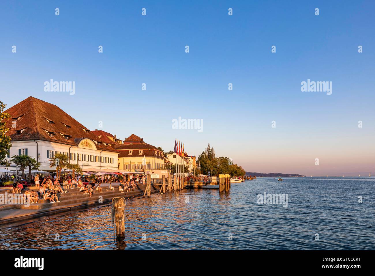 People on the lakeside promenade and Restaurant Markthalle Greth, Ueberlingen, Lake Constance, Baden-Wuerttemberg, Germany Stock Photo
