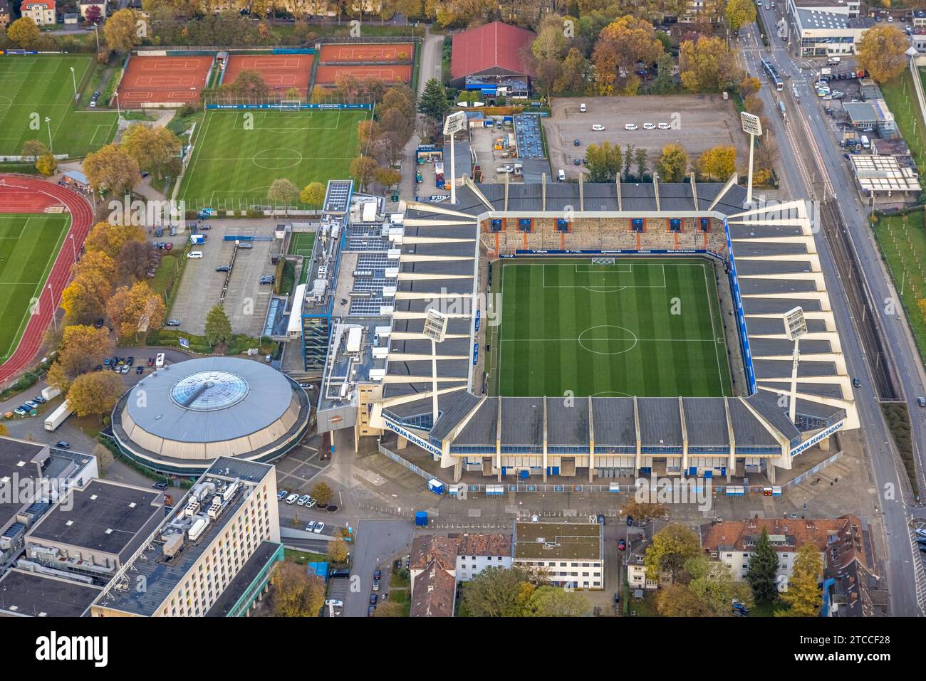 Aerial view, Bundesliga stadium Vonovia Ruhrstadion soccer ground of VfL Bochum 1848 with floodlight masts, round sports hall and training sports fiel Stock Photo