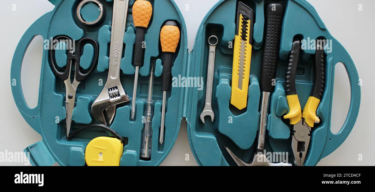 Opened plastic case with electrical tools kit on white detailed stock photo Stock Photo