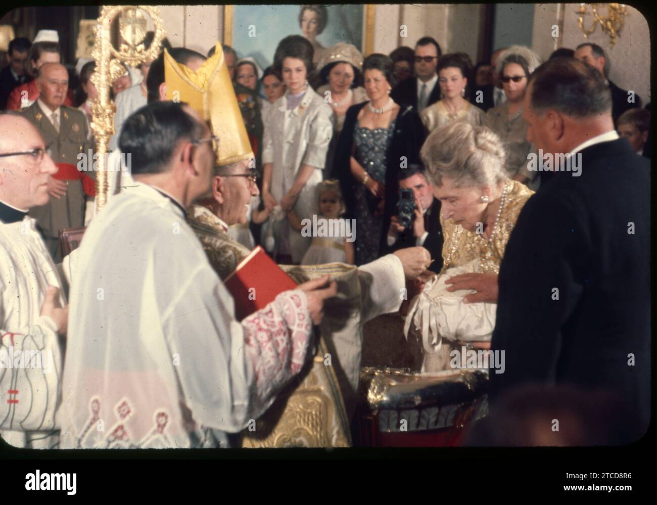 Madrid, 02/08/1968. Baptism of the infant Don Felipe in the Zarzuela Palace. In the image, the Archbishop of Madrid pours the baptismal waters over the head of the newborn, who is sponsored by Queen Victoria Eugenia and the Count of Barcelona. In the background, crouching, ABC photographer José Sánchez Martínez. Credit: Album / Archivo ABC / Jaime Pato,Álvaro García Pelayo,José Sánchez Martínez Stock Photo