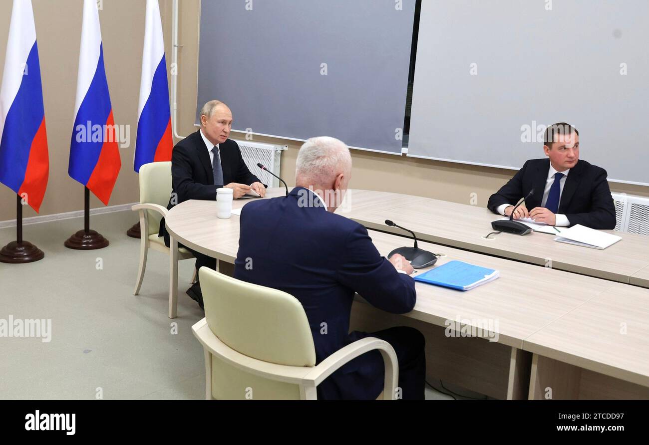 Severodvinsk, Russia. 11th Dec, 2023. Russian President Vladimir Putin comments during a face-to-face meeting with Arkhangelsk Region Governor Alexander Tsybulsky, right, and Presidential Envoy to the Northwestern Federal District Alexander Gutsan, center, and teleconference participants to discuss development of settlements in the Russian Arctic, December 11, 2023 in Arkhangelsk, Russia. Credit: Mikhael Klimentyev/Kremlin Pool/Alamy Live News Stock Photo