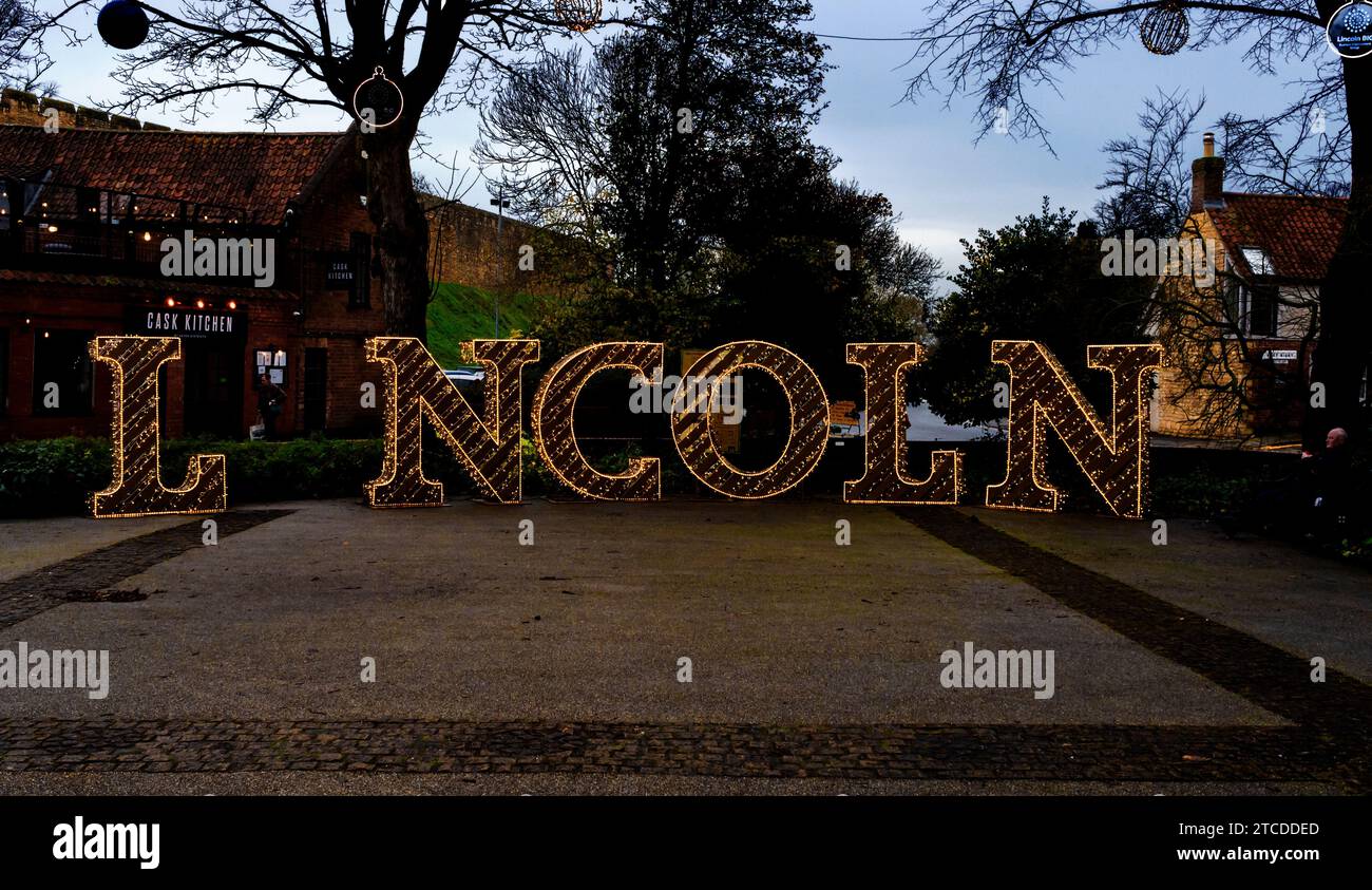 Large illuminated letters with gap for people to stand for photos