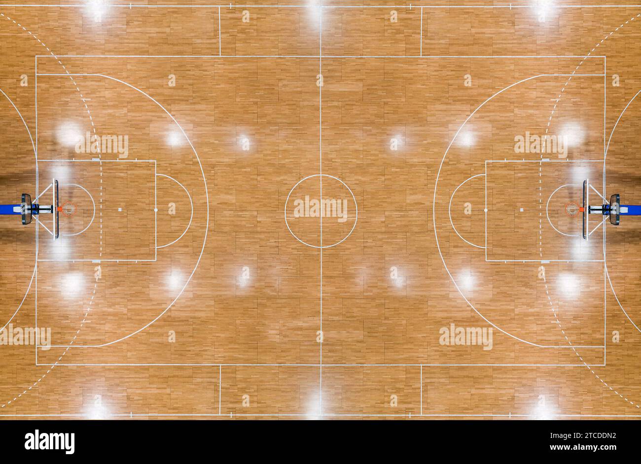Top view of a parquet basketball court with hoops installed and