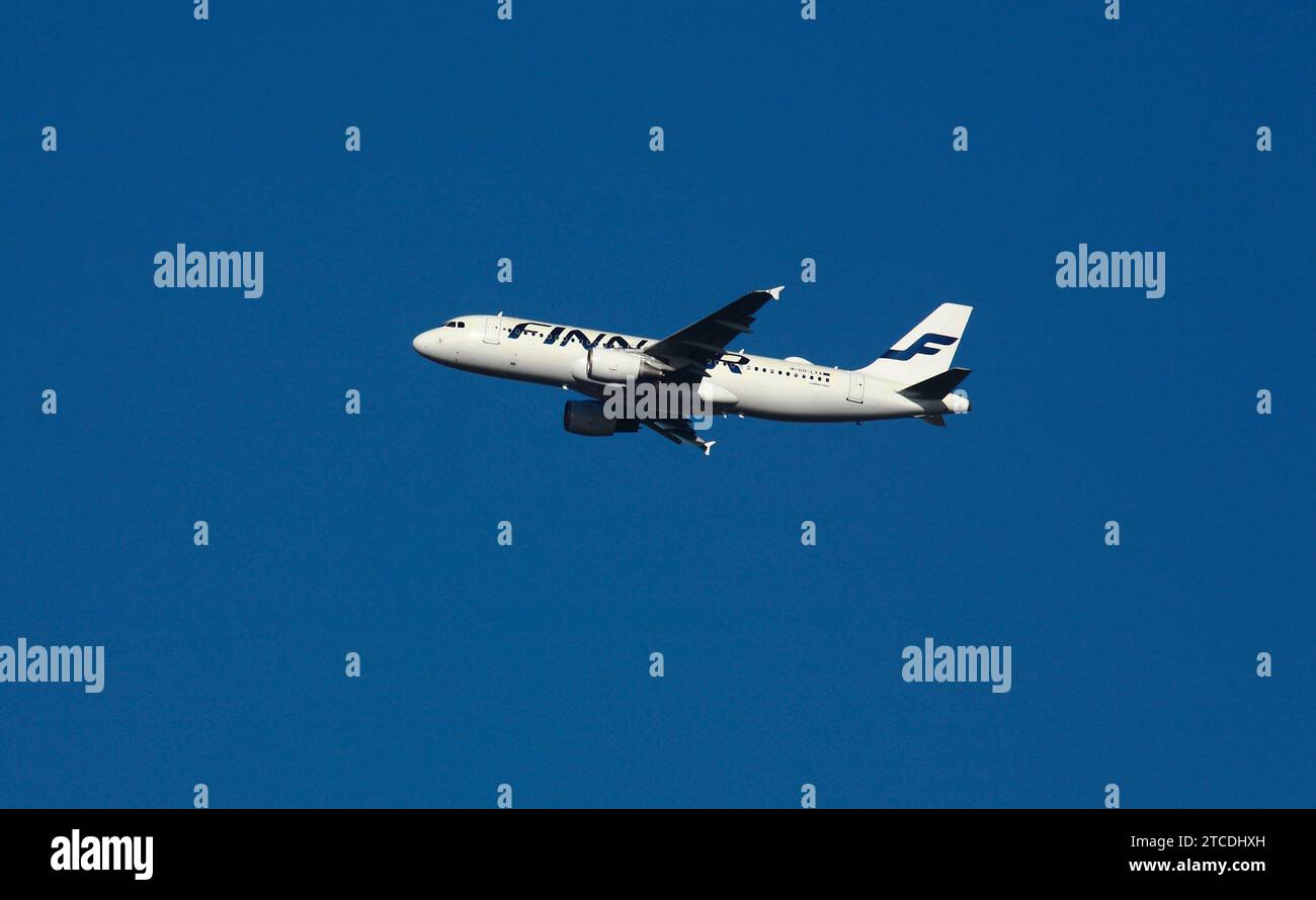 FINNAIR Passenger plane Flying over Southwest London United Kingdom Stock Photo