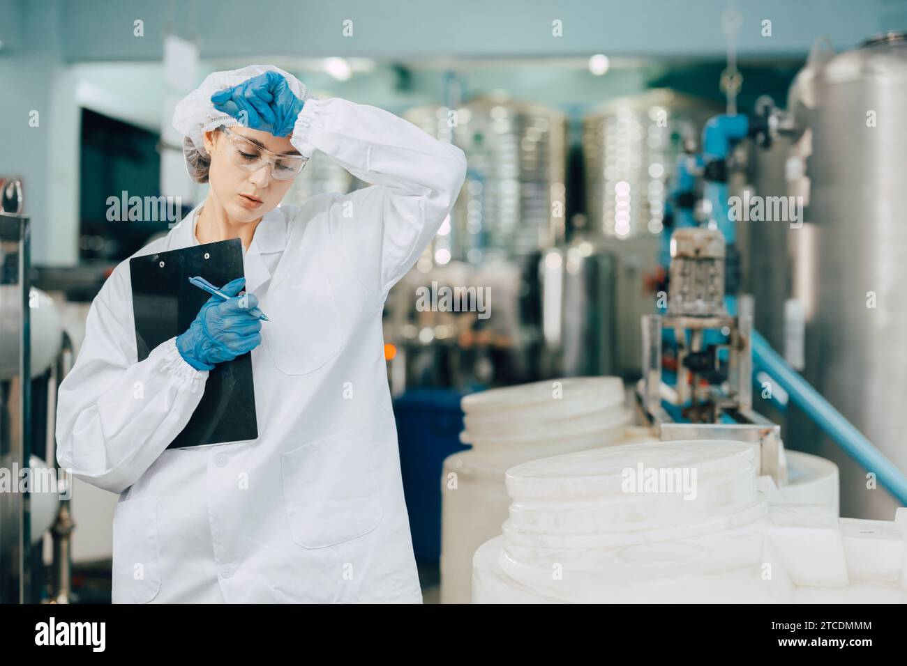 Tired exhausted women worker work in food and drinks plant factory