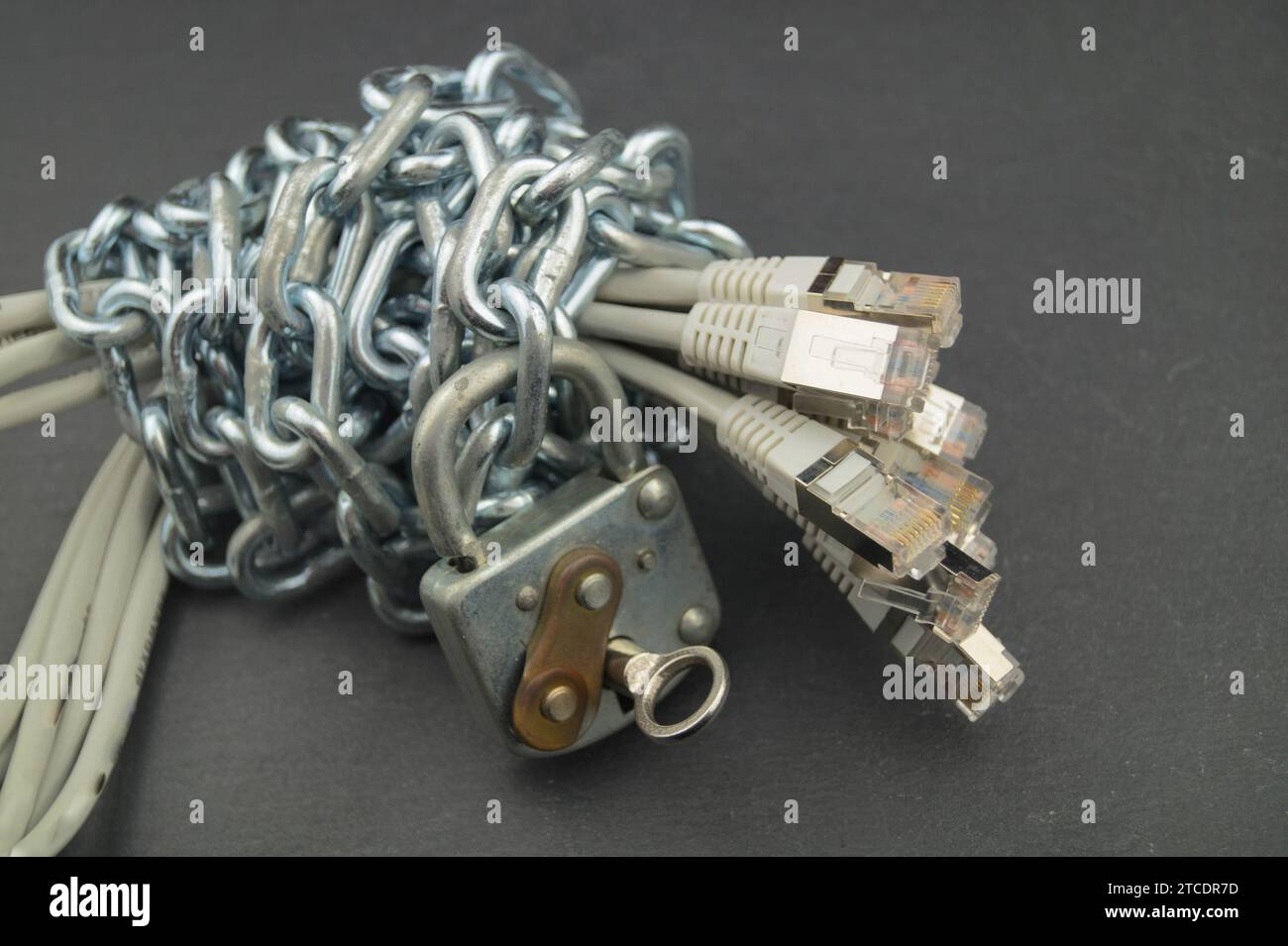 patch cables with chain and padlock, symbolic image for data protection
