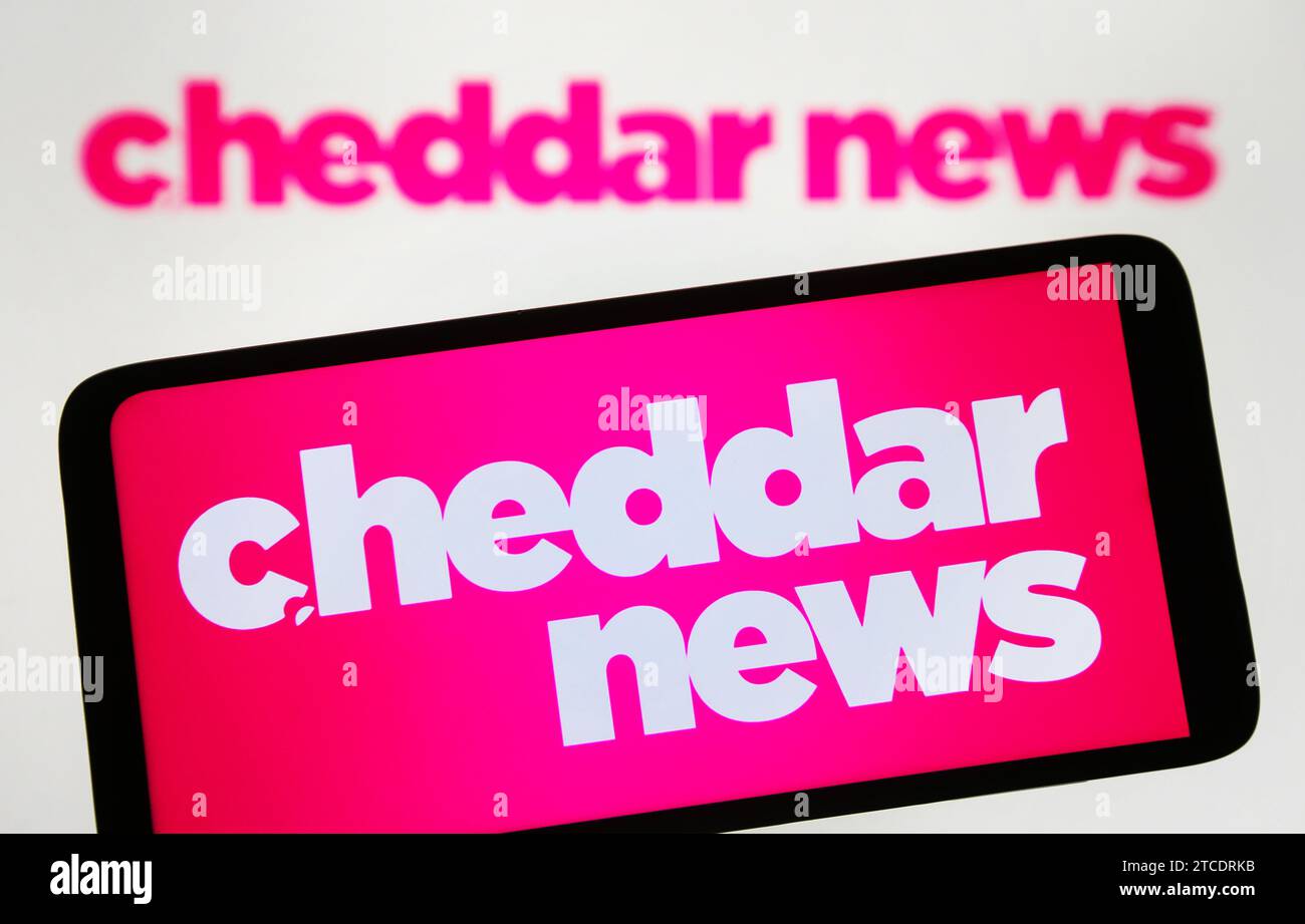Ukraine. 11th Dec, 2023. In this photo illustration, Cheddar News logo is seen on a smartphone and on a pc screen. Credit: SOPA Images Limited/Alamy Live News Stock Photo