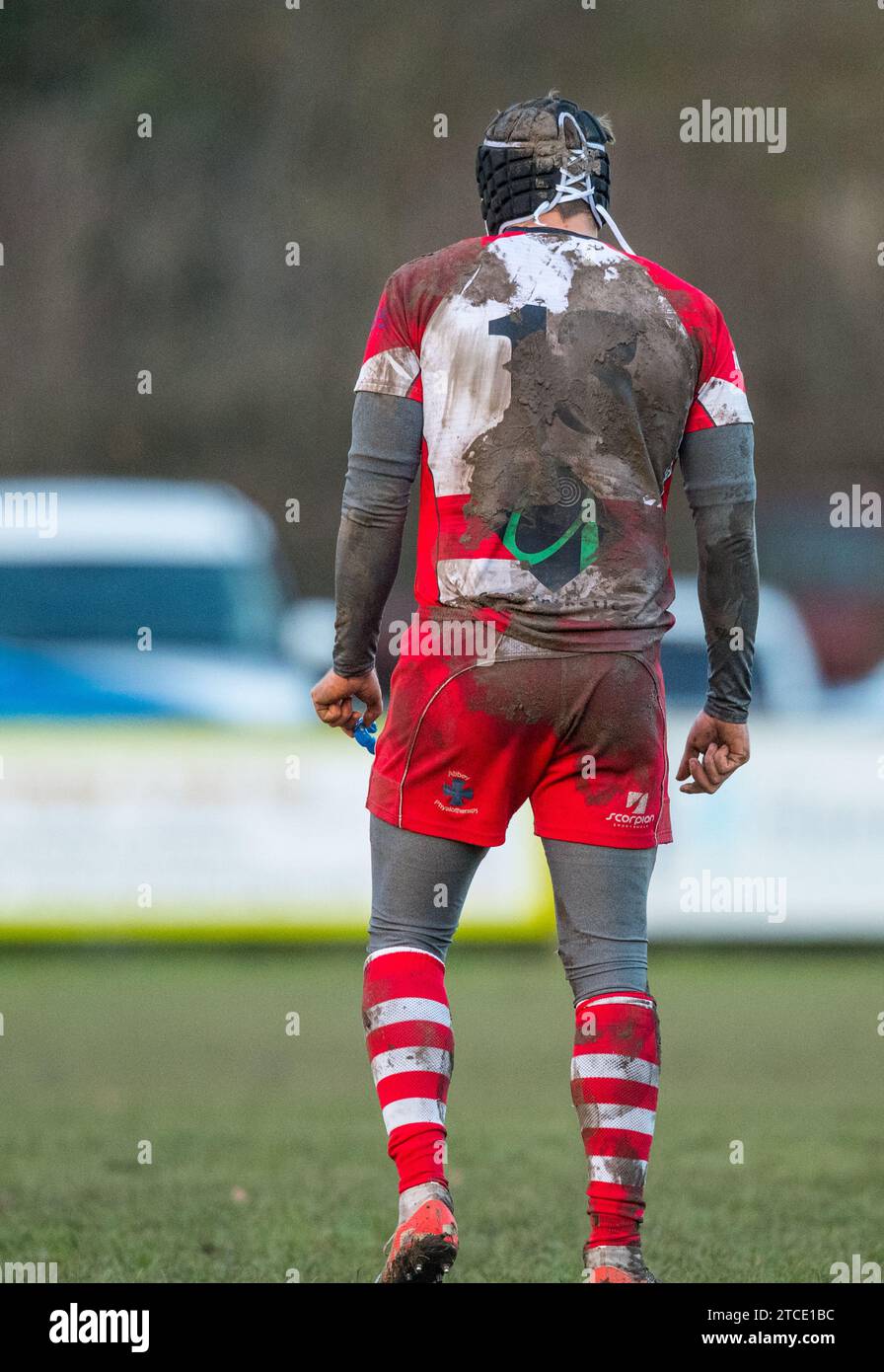 English amateur Rugby Union player with a dirty and muddy number 13 shirt. Stock Photo