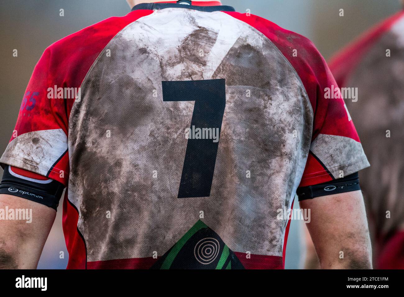 English amateur Rugby Union player with a dirty and muddy number 7 shirt. Stock Photo
