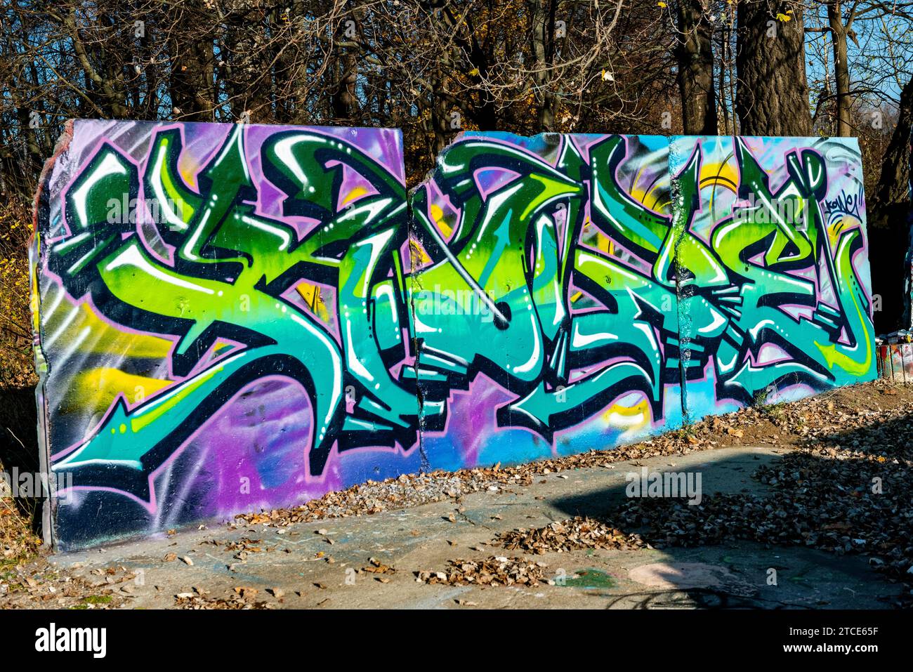 Berlin, Germany. A dump site for parts of the former Berlin Wall is transferred to a huge graffity and mural site, where urban artists and painters find a place to leaver their creative pieces. Stock Photo