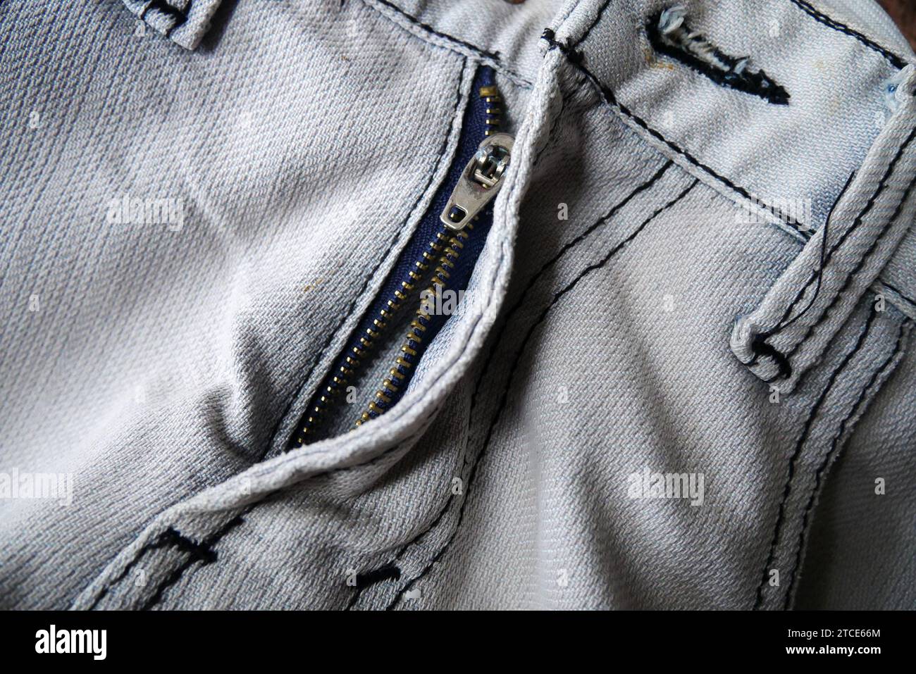 The jean trousers had a broken zipper Stock Photo Alamy