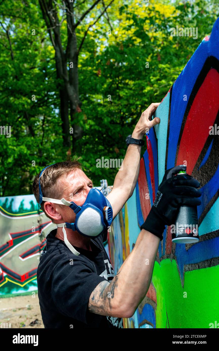 Berlin, Germany. Graffiti artist creating jet another piece of urban ...