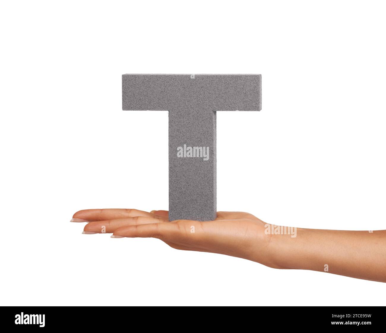 Woman, hand and letter T or alphabet in studio for advertising, learning and teaching presentation. Sign, font and character for text and Stock Photo