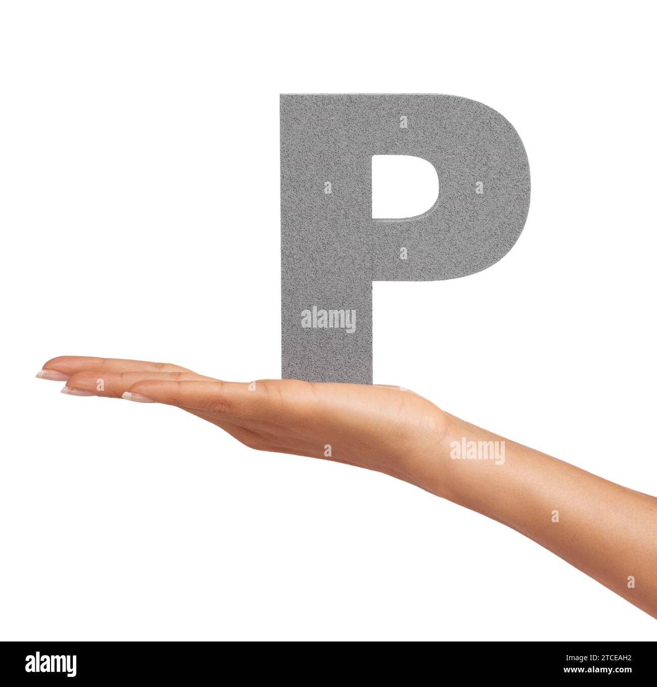 Woman, hand and letter P or alphabet in studio for marketing, learning or teaching presentation. Sign, font or character for icon, text or Stock Photo