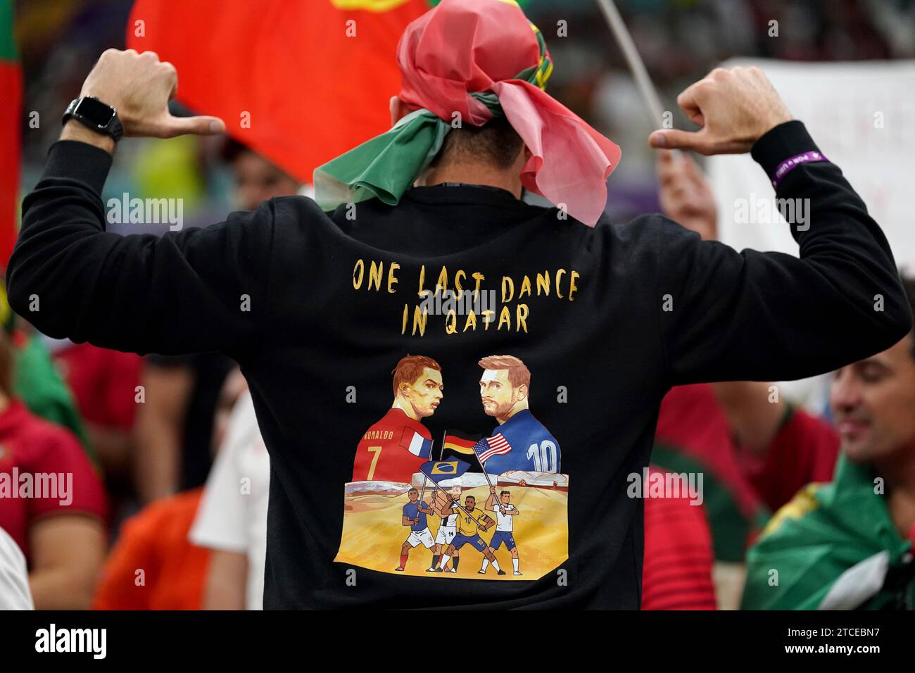 File photo dated 28/11/22 of a Portugal fan with a sweatshirt of Cristiano Ronaldo and Argentina's Lionel Messi. Lionel Messi and Cristiano Ronaldo will go head to head once again when Inter Miami face Al-Nassr in a pre-season friendly in Saudi Arabia in February. Issue date: Tuesday December 12, 2023. Stock Photo