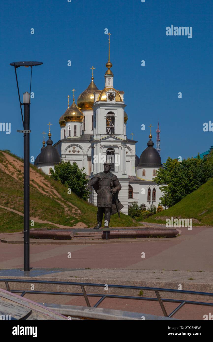 Assumption Cathedral in the city of Dmitrov, Russia. In the foreground is a monument to Yuri Dolgoruky. Stock Photo