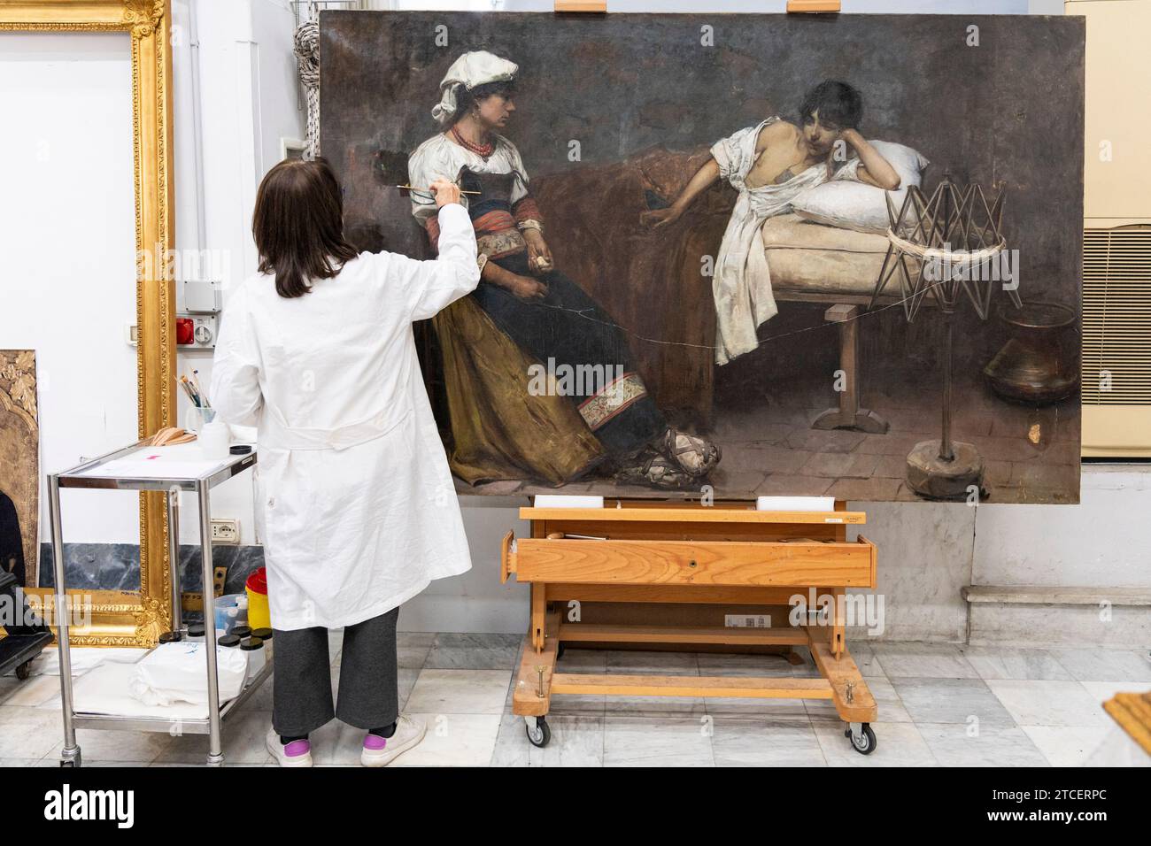 Vatican City, Vatican. 11th Dec, 2023. Restorer Rossana Giardina works on painting at the 'Painting and Wood Materials Restoration Laboratory' inside the Vatican Museums. 'Beyond the surface: the restorer's gaze' is the title of the exhibition initiative with which the Vatican Museums celebrate the centenary of the foundation of the 'Painting and Wooden Materials Restoration Laboratory'. (Photo by Stefano Costantino/SOPA Images/Sipa USA) Credit: Sipa USA/Alamy Live News Stock Photo