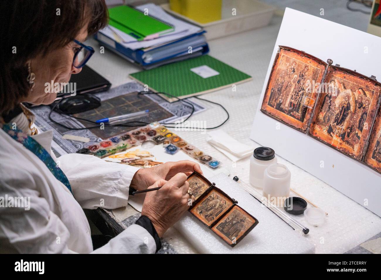 Vatican City, Vatican. 11th Dec, 2023. Restorer Rossana Giardina works on an artwork at the 'Painting and Wood Materials Restoration Laboratory' inside the Vatican Museums. 'Beyond the surface: the restorer's gaze' is the title of the exhibition initiative with which the Vatican Museums celebrate the centenary of the foundation of the 'Painting and Wooden Materials Restoration Laboratory'. (Photo by Stefano Costantino/SOPA Images/Sipa USA) Credit: Sipa USA/Alamy Live News Stock Photo