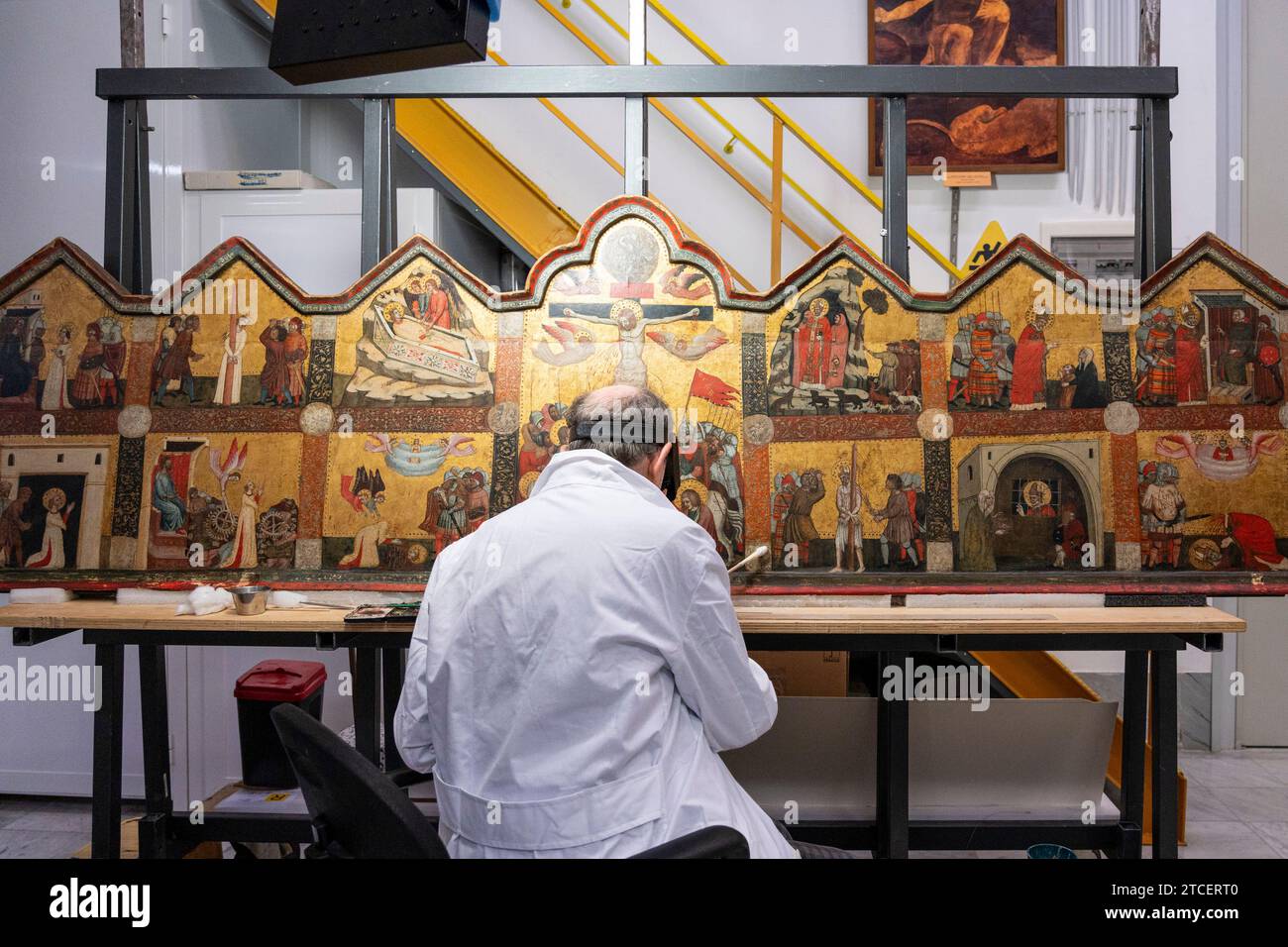 Vatican City, Vatican. 11th Dec, 2023. Restorer Marco Pratelli works on a painting at the 'Painting and Wood Materials Restoration Laboratory' inside the Vatican Museums. 'Beyond the surface: the restorer's gaze' is the title of the exhibition initiative with which the Vatican Museums celebrate the centenary of the foundation of the 'Painting and Wooden Materials Restoration Laboratory'. (Photo by Stefano Costantino/SOPA Images/Sipa USA) Credit: Sipa USA/Alamy Live News Stock Photo