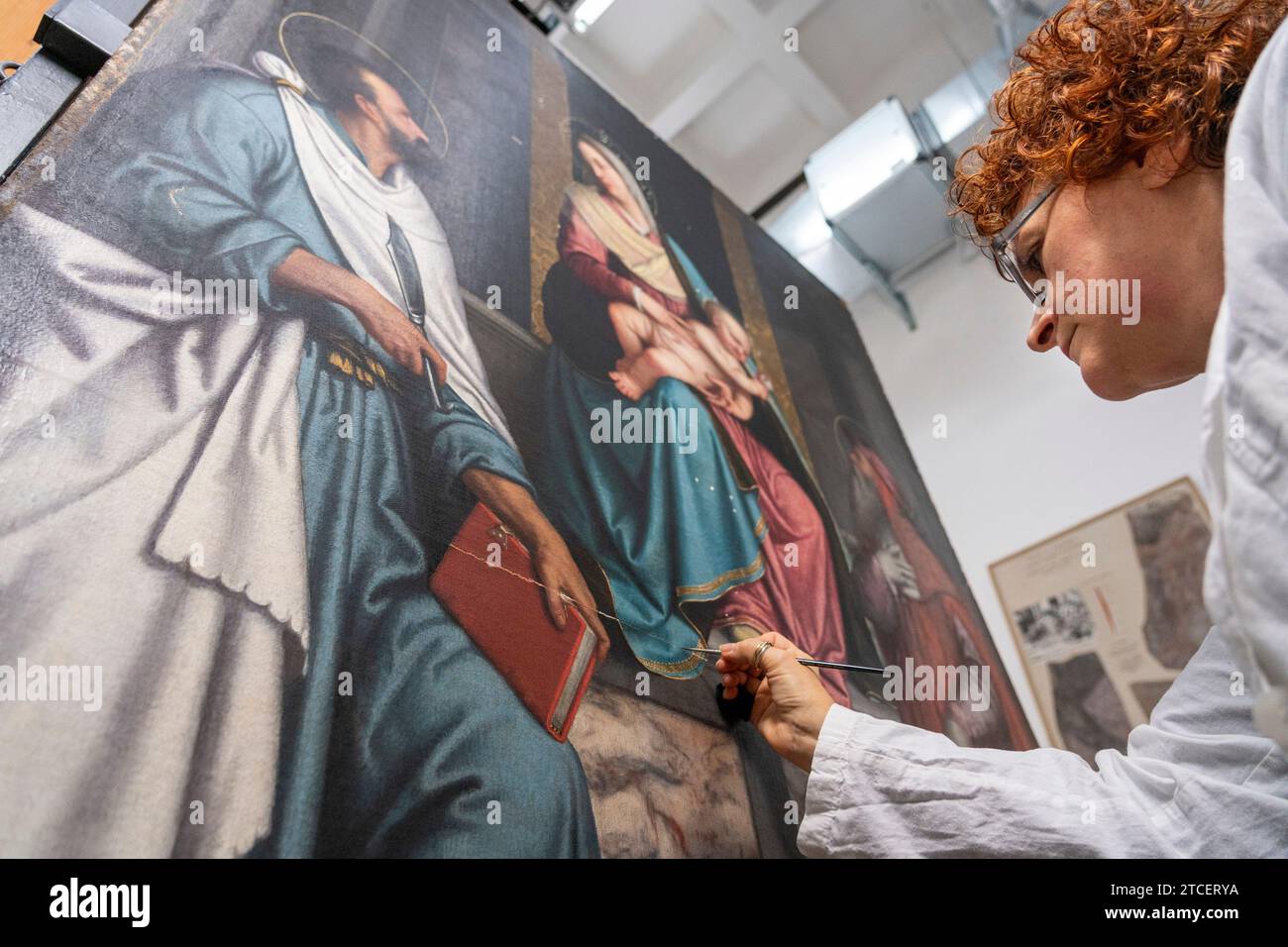 Vatican City, Vatican. 11th Dec, 2023. Restorer Alessandra Zarelli works on a painting at the 'Painting and Wood Materials Restoration Laboratory' inside the Vatican Museums. 'Beyond the surface: the restorer's gaze' is the title of the exhibition initiative with which the Vatican Museums celebrate the centenary of the foundation of the 'Painting and Wooden Materials Restoration Laboratory'. (Photo by Stefano Costantino/SOPA Images/Sipa USA) Credit: Sipa USA/Alamy Live News Stock Photo