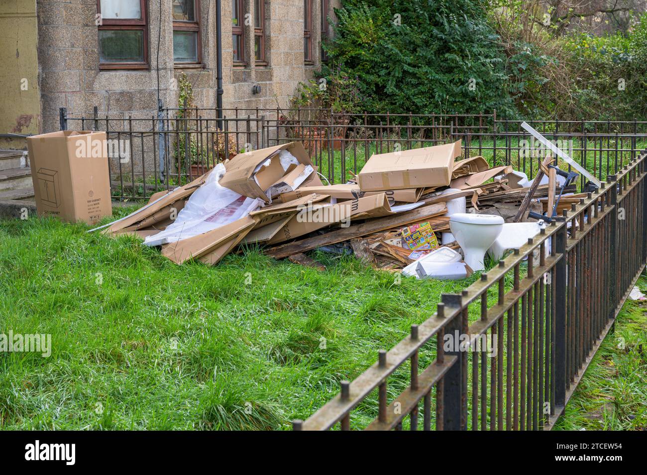 Packaging and old bathroom items waiting to be collected from a garden during house renovations, Glasgow, Scotland, UK, Europe Stock Photo