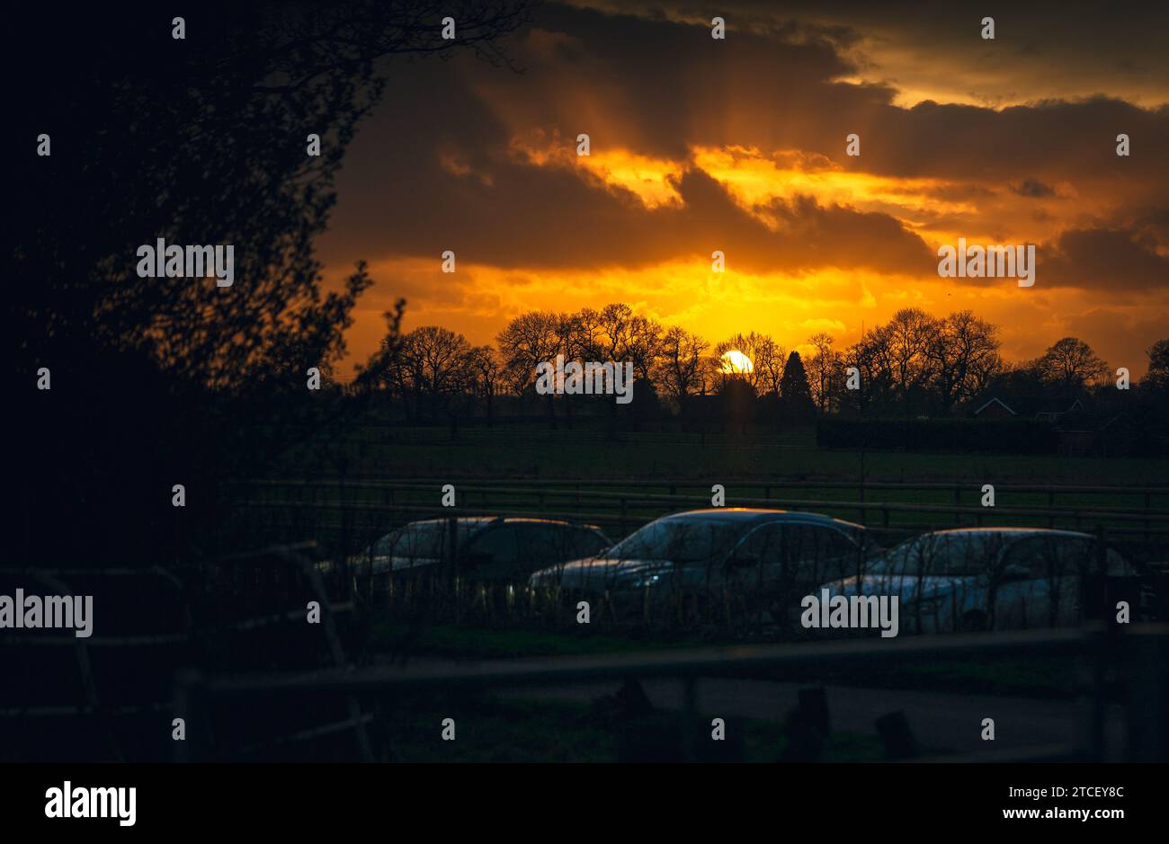 Winter sunset behind a car park in the Cheshire Countryside. Stock Photo