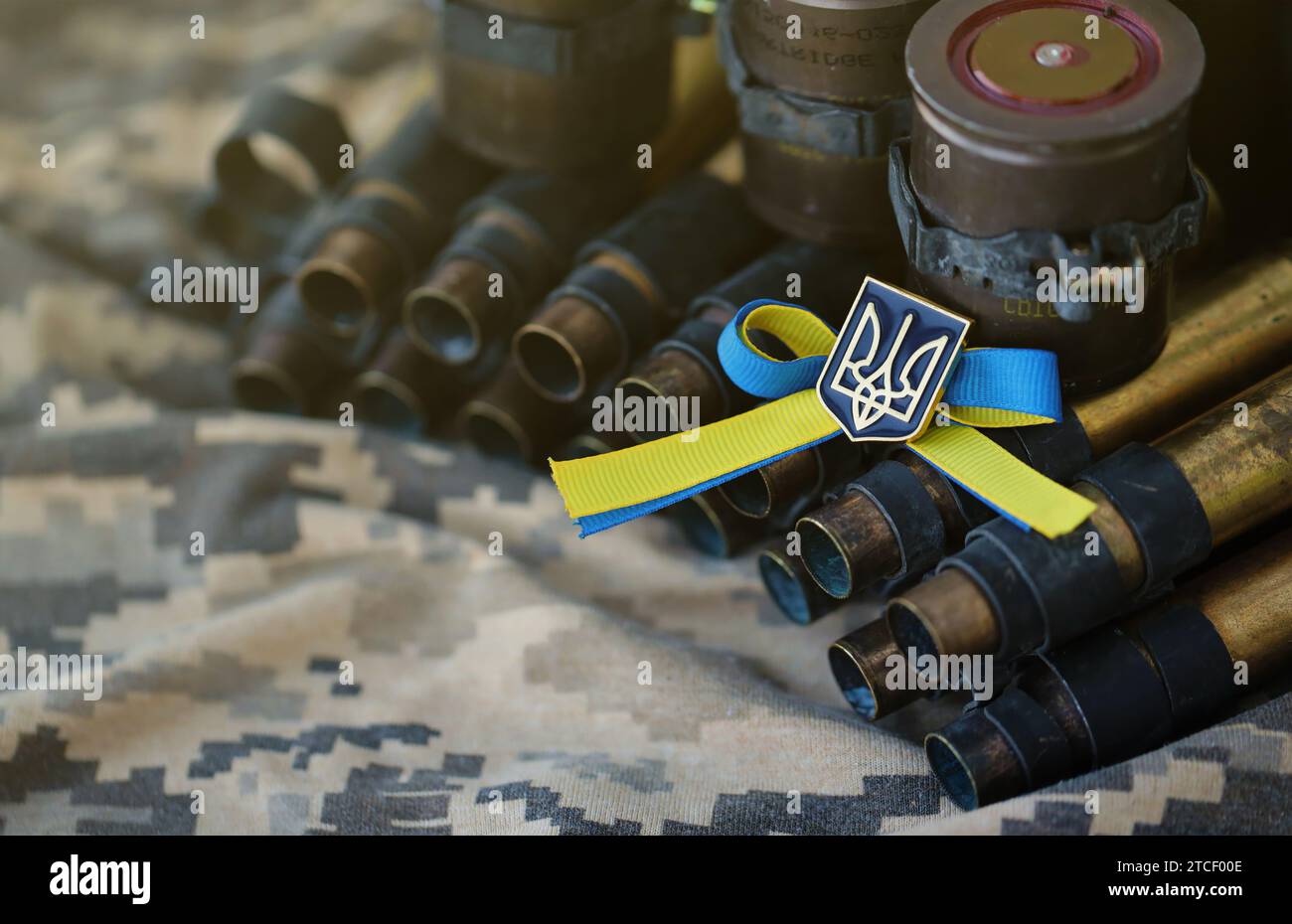 Ukrainian symbol on machine gun belt lies on ukrainian pixeled military ...