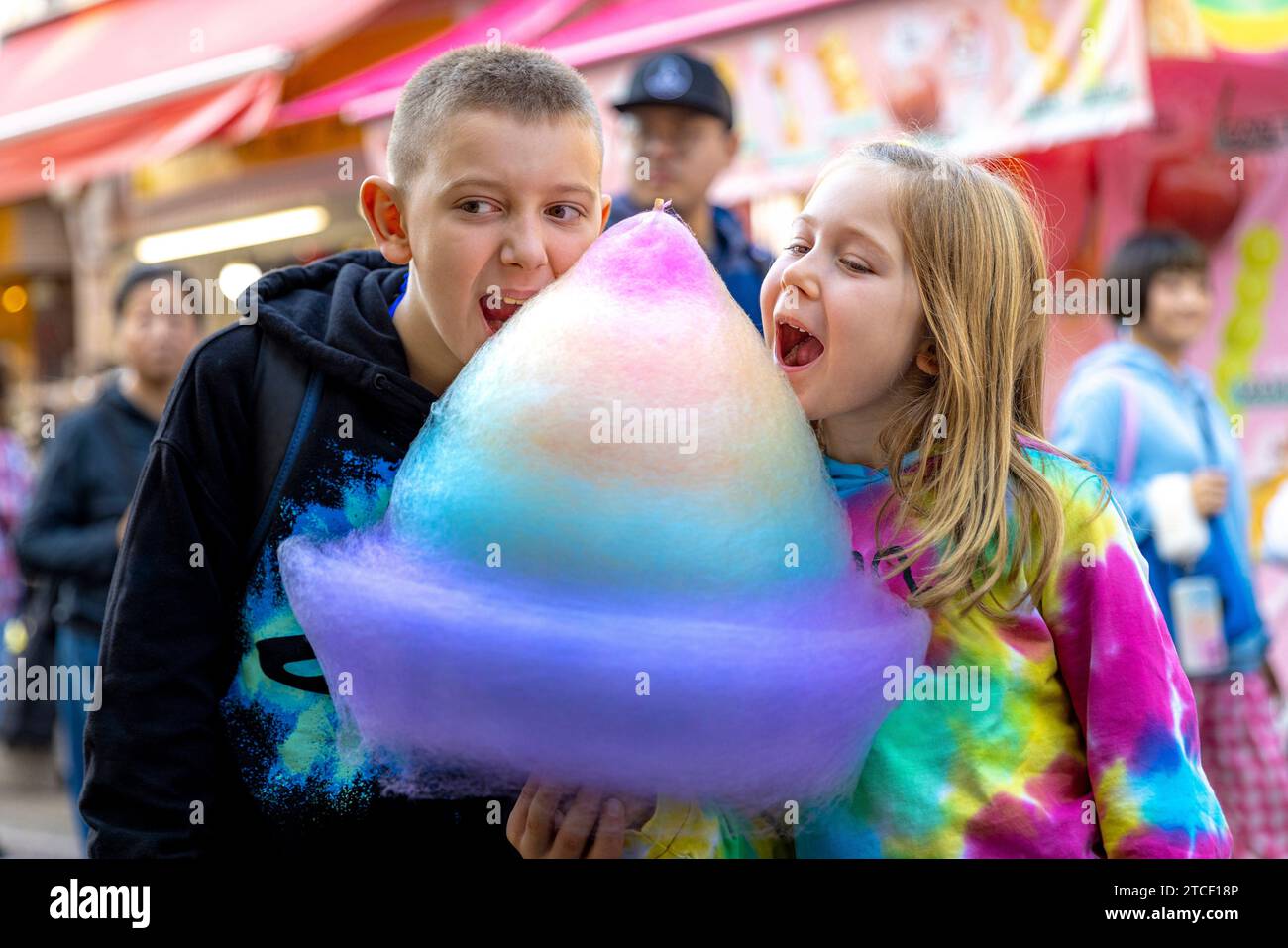 children eat a rainbow cotton candy in the Harajuku neighborhood Stock Photo