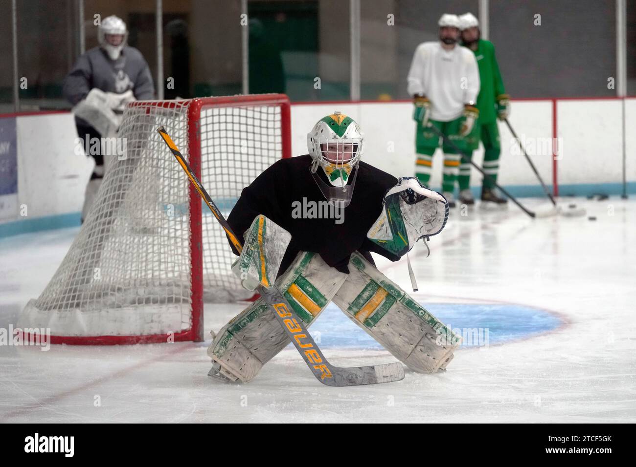 Evan Smolik prepares to stop a shot during a hockey practice Wednesday