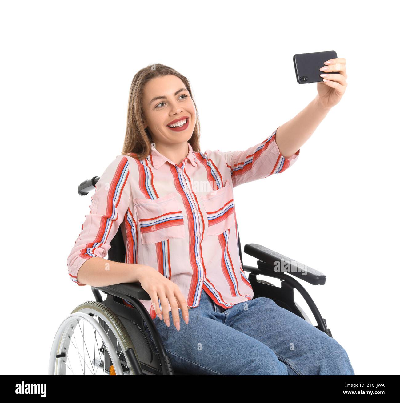 Young woman in wheelchair taking selfie on white background Stock Photo ...