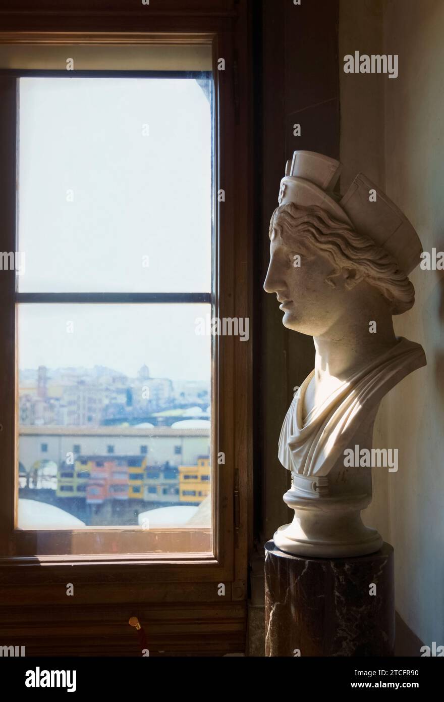 Head of a Female Goddess (1) IDed as Cybele, Roman copy (provenance-?, ca 1-2 AD) based on the 4 c. BC Greek originals + Ponte Vecchio view, Florence. Stock Photo