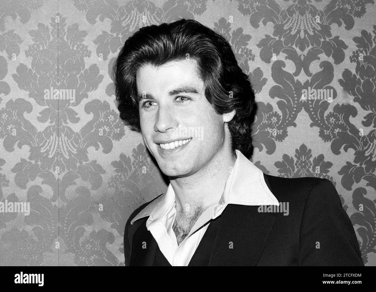 John Travolta at a press conference for 