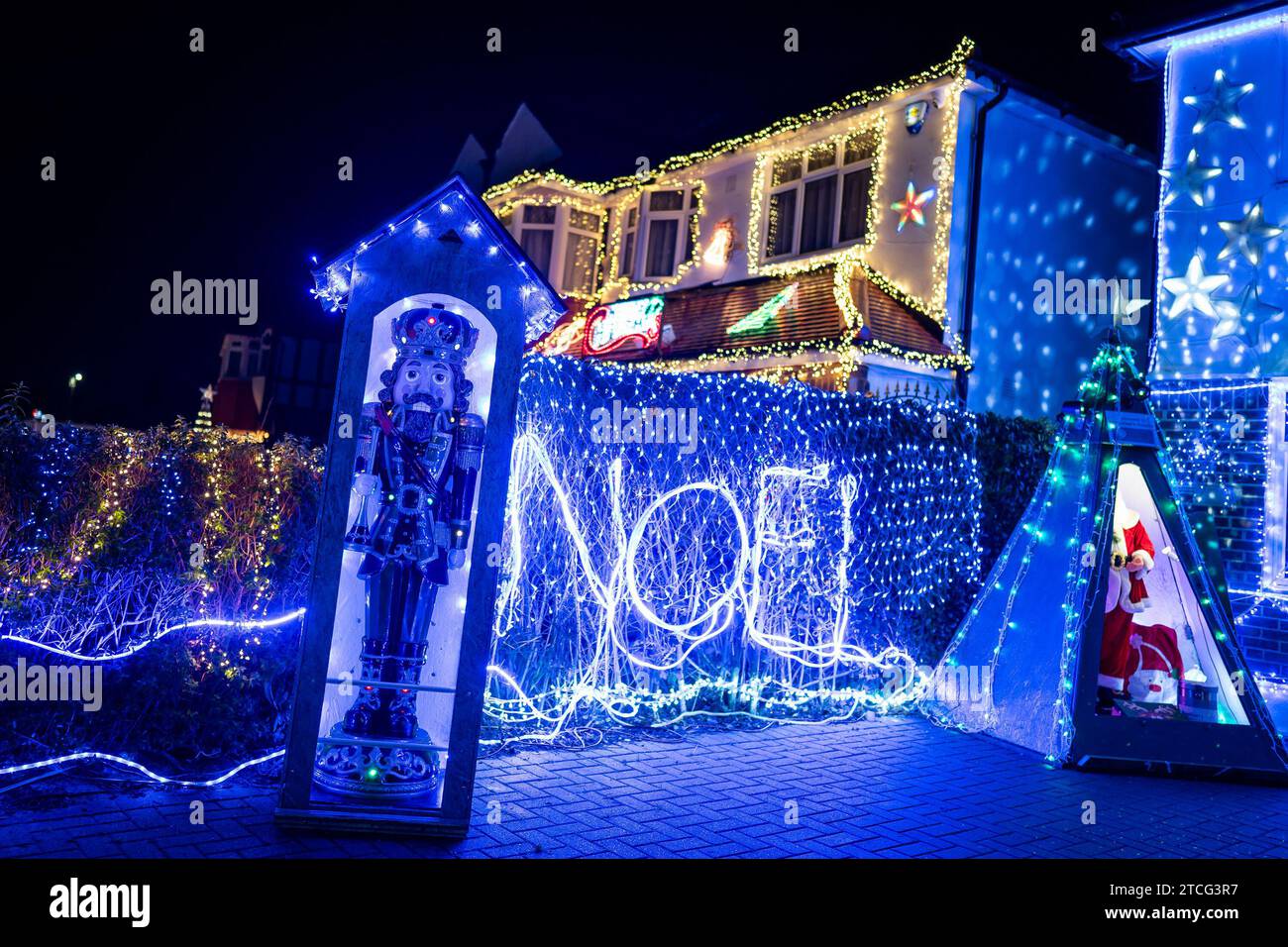 Houses illuminated by Christmas lights on Lower Morden Lane, Morden