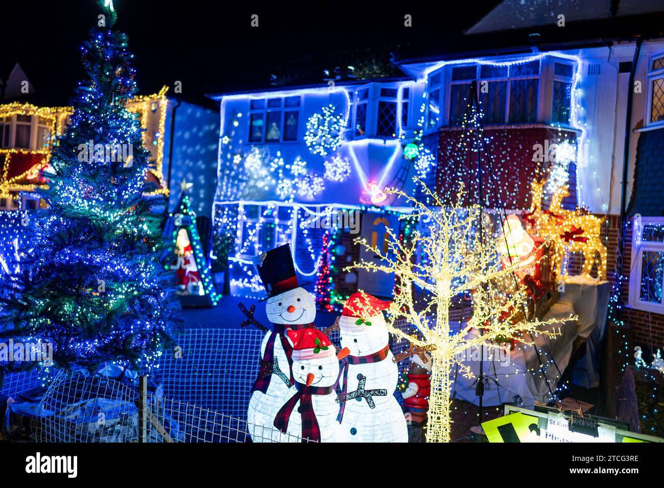 Houses illuminated by Christmas lights on Lower Morden Lane, Morden