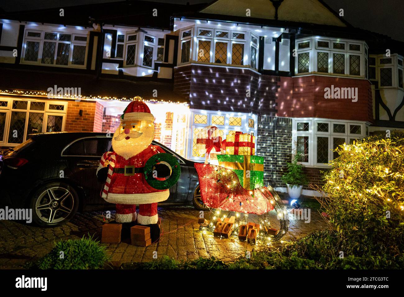 Houses illuminated by Christmas lights on Lower Morden Lane, Morden