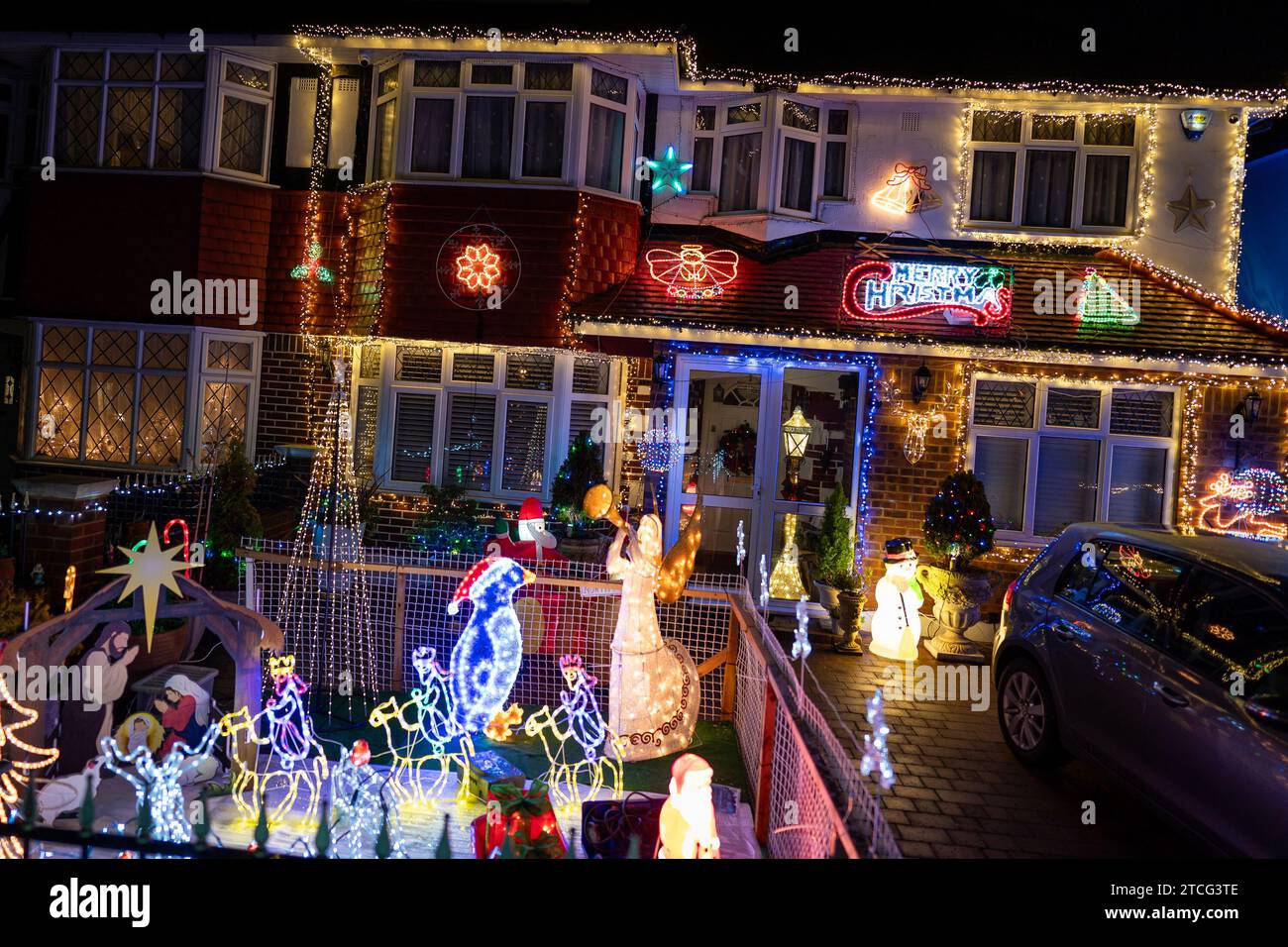 Houses illuminated by Christmas lights on Lower Morden Lane, Morden