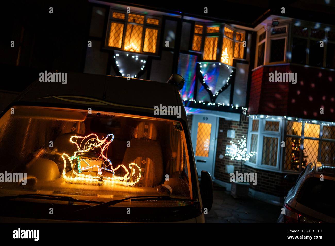 Houses illuminated by Christmas lights on Lower Morden Lane, Morden