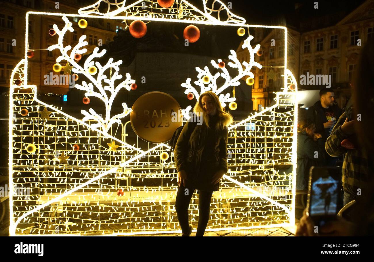 Prague, Czech Republic. 12th Dec, 2023. A woman poses for photos in