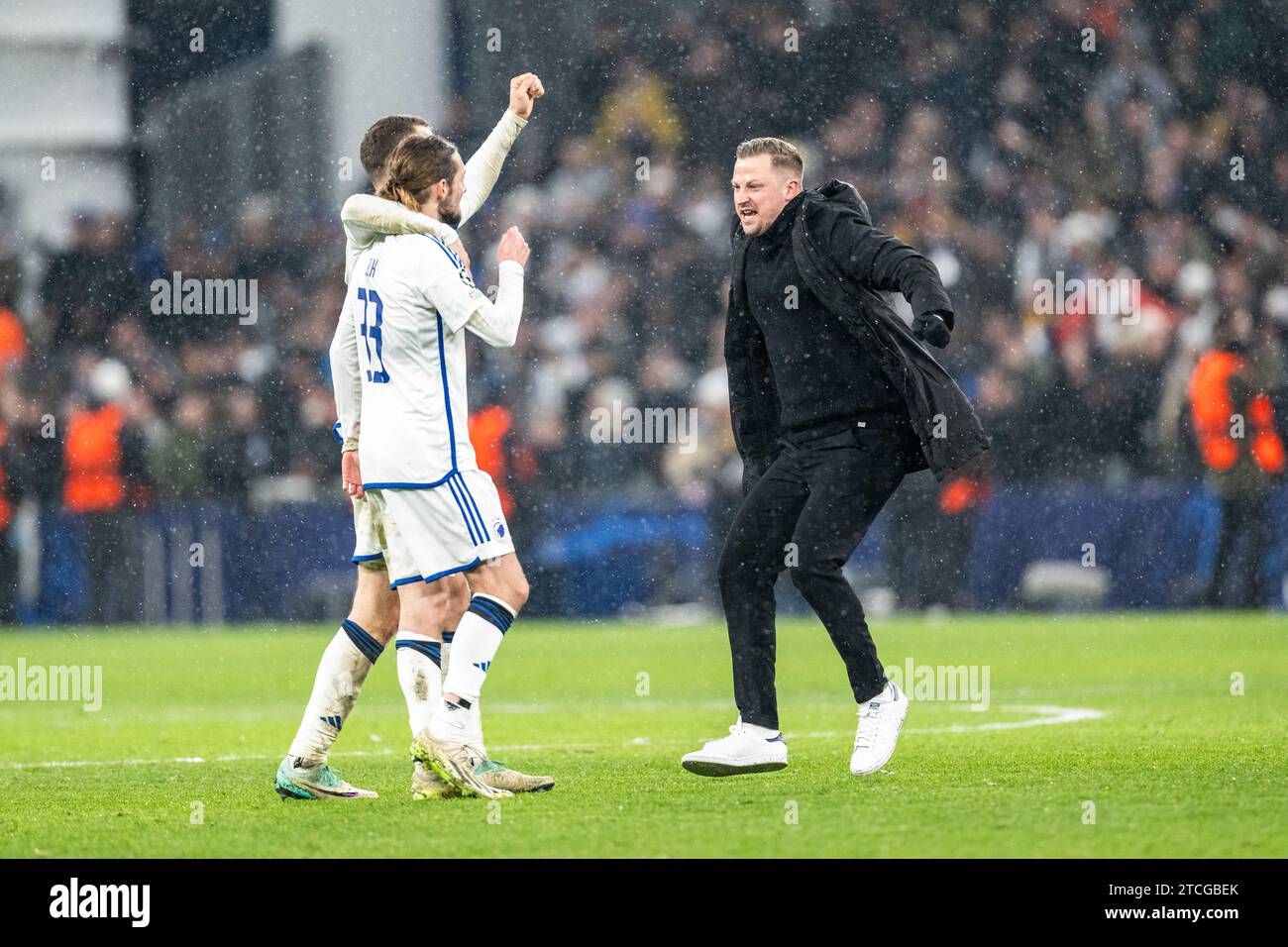 Copenhagen, Denmark. 12th Dec, 2023. Head coach Jacob Neestrup of FC Copenhagen seen celebrating with Rasmus Falk (33) and Viktor Claesson (7) after the win in the UEFA Champions League match between FC Copenhagen and Galatasaray at Parken in Copenhagen. (Photo Credit: Gonzales Photo/Alamy Live News Stock Photo