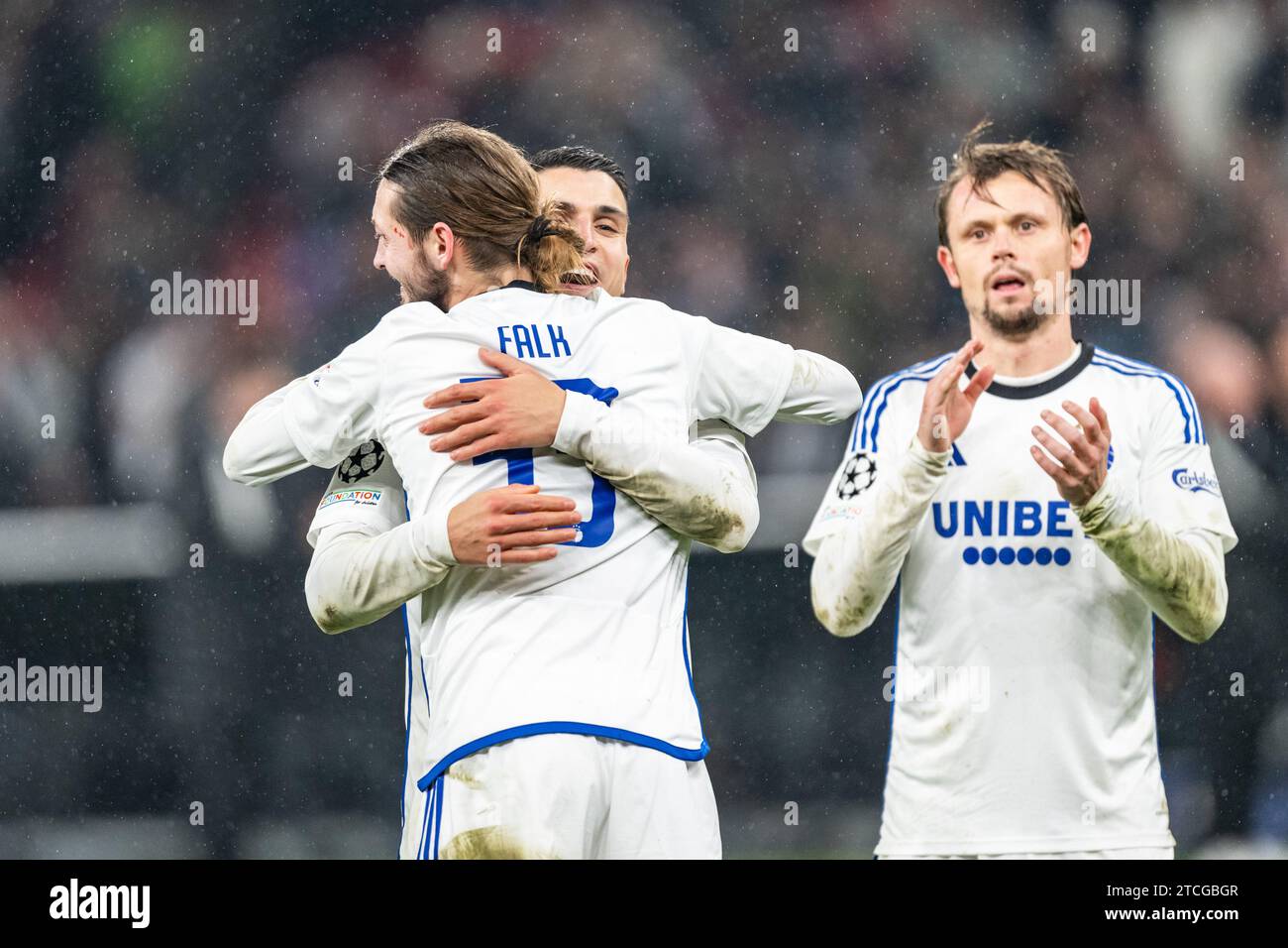 Copenhagen, Denmark. 12th Dec, 2023. Rasmus Falk (33) and Mohamed Elyounoussi of FC Copenhagen seen celebrating after the victory in the UEFA Champions League match between FC Copenhagen and Galatasaray at Parken in Copenhagen. (Photo Credit: Gonzales Photo/Alamy Live News Stock Photo