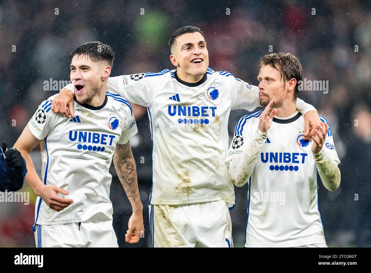 Copenhagen, Denmark. 12th Dec, 2023. (L-R) Kevin Diks, Mohamed Elyounoussi and Peter Ankersen of FC Copenhagen seen celebrating after the victory in the UEFA Champions League match between FC Copenhagen and Galatasaray at Parken in Copenhagen. (Photo Credit: Gonzales Photo/Alamy Live News Stock Photo