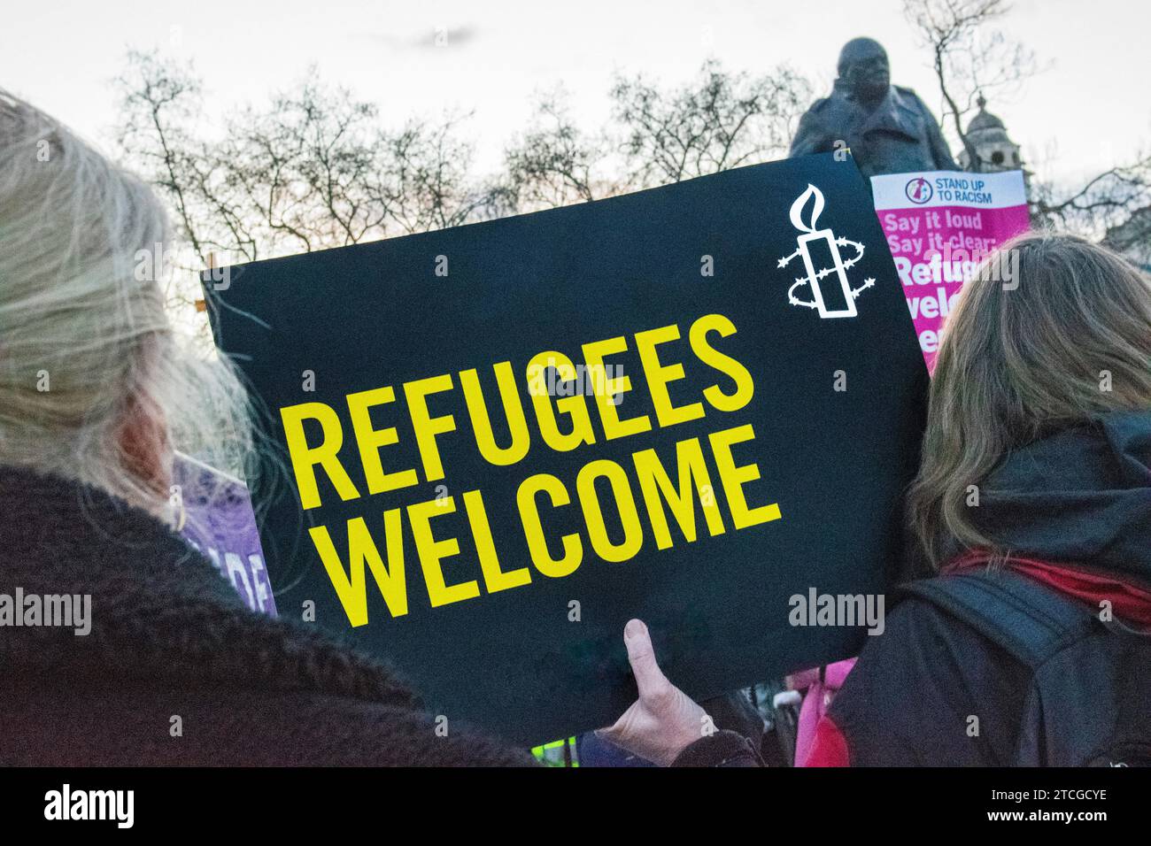 Protesters gather outside Westminster Square in opposition to the Illegal Migration Bill. Including Safe Passage & Stand Up to Racism Stock Photo