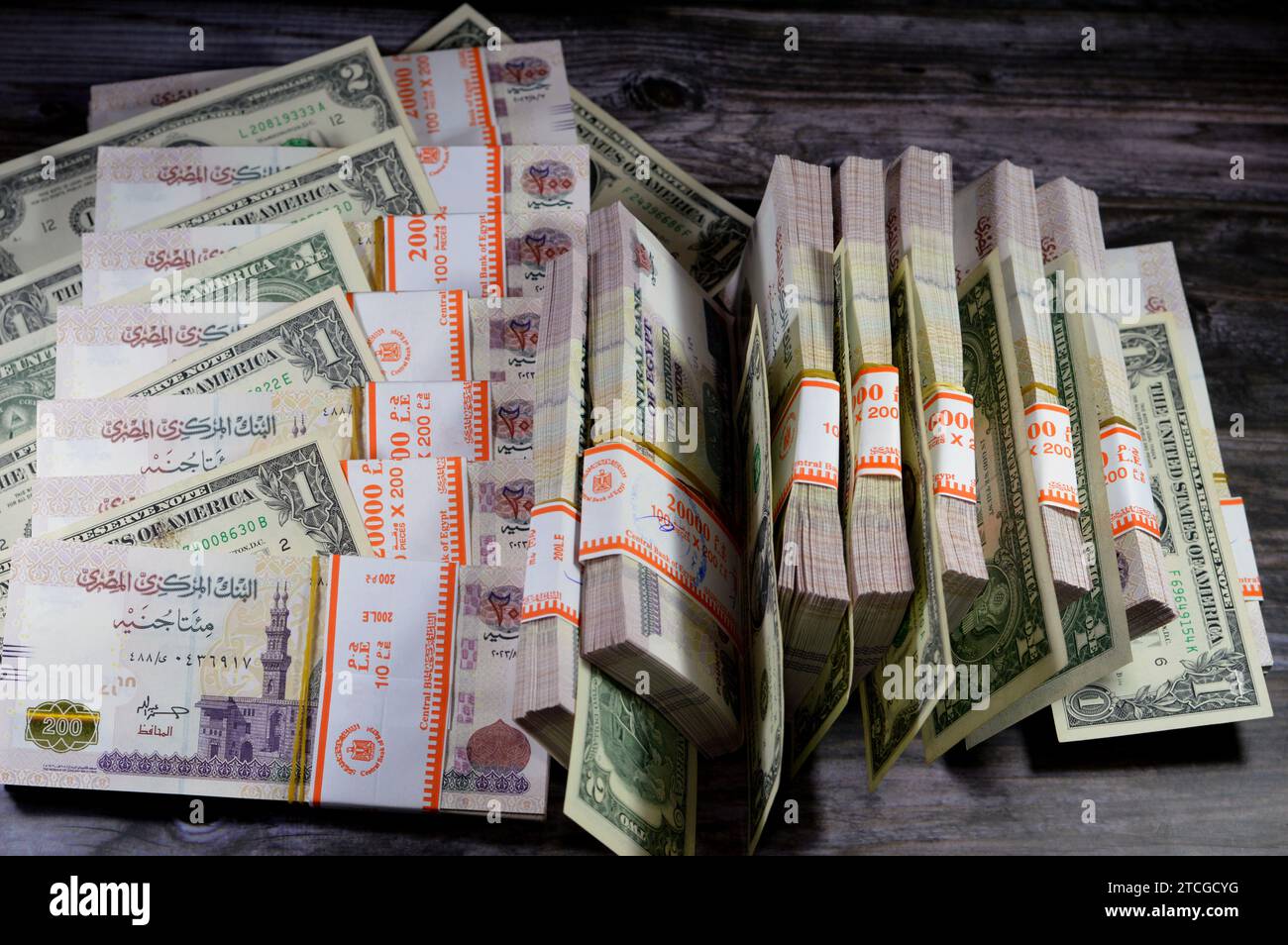 piles-and-stacks-of-egypt-money-thousands-of-pounds-currency-banknotes-bills-of-200-egp-le-egyptian-money-exchange-rate-and-usa-american-dollars-ban-2TCGCYG.jpg