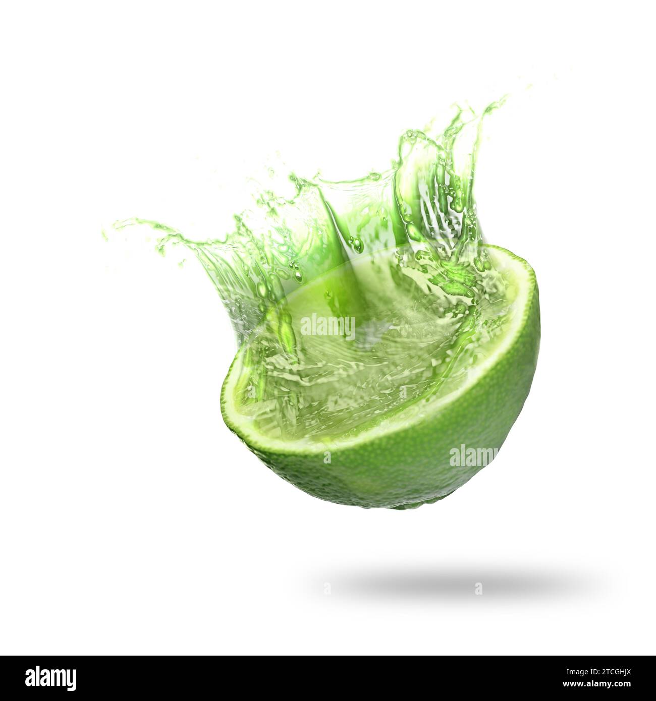 Lime with splashing juice isolated on white Stock Photo