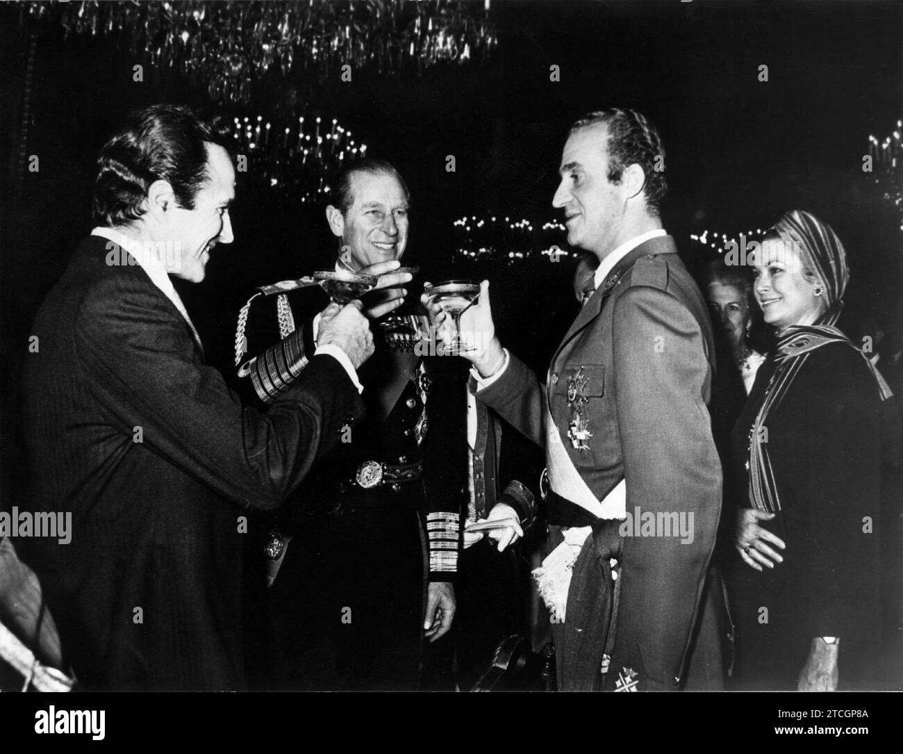 11/27/1975. Acts of exaltation to the Crown. HM Juan Carlos and the Duke of Edinburgh, husband of Queen Elizabeth II of England, appear toasting during the reception offered at the Royal Palace on the occasion of the official proclamation of Juan Carlos I as King of Spain. Credit: Album / Archivo ABC Stock Photo