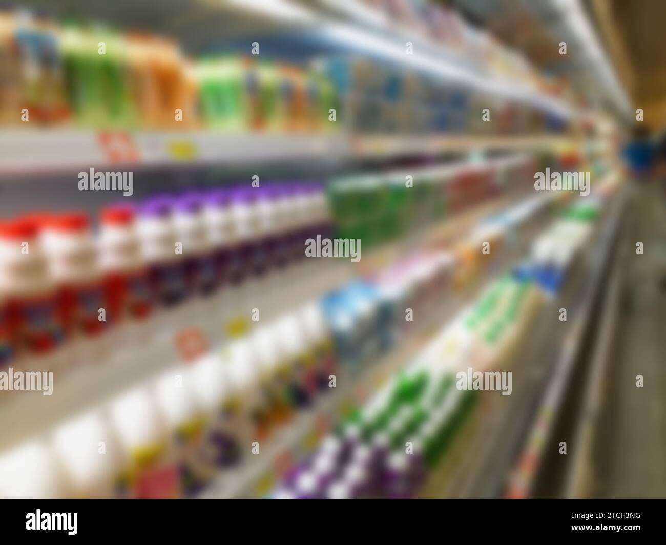 blur milk products bottles on refrigerator shelf in supermarket Stock Photo