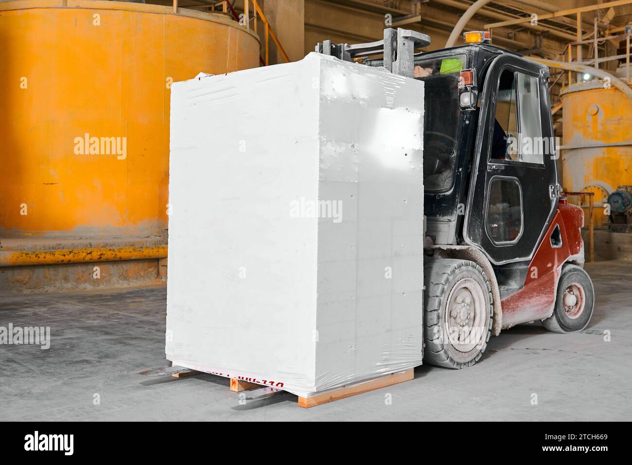 Forklift with stack of finished blocks in plant workshop Stock Photo ...