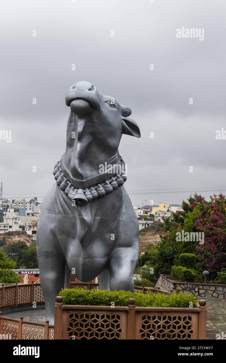 hindu god holy bull nandi isolated statue with bright background at morning from unique angle Stock Photo