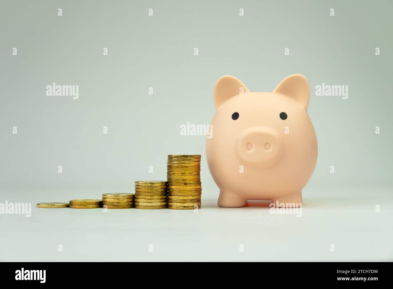 Piggy bank with euro coin stacks - concept of increase. gold coins and ...