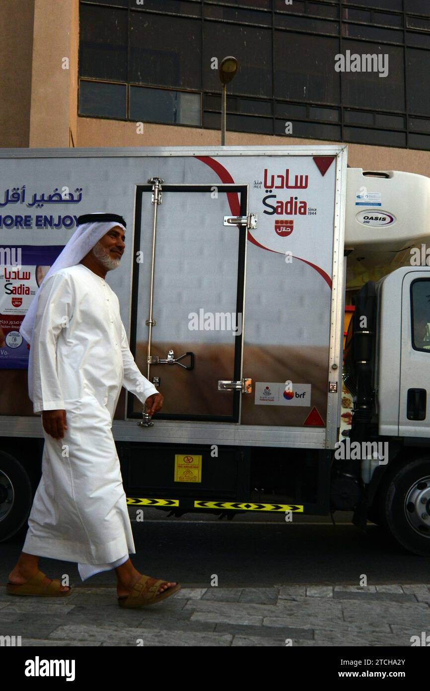 An Emirati man walking in the Bur Dubai souk in Dubai, UAE. Stock Photo